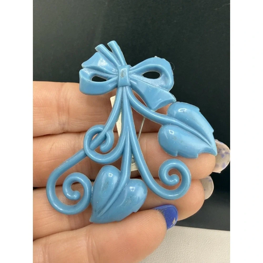 Vintage Brooch Light‎ Blue Molded Celluloid Bow